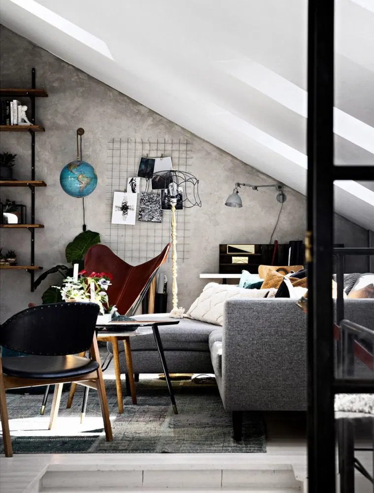 dvoetažni stan u potkrovlju uređen u industrijskom stilu